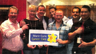 Staff and customers of the Tannery in Moira with the cheque for Marie Curie. The money was raised at the recent Northern Ireland steak eating championships.