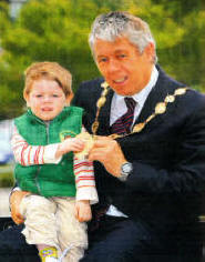 Newly elected Mayor of Lisburn SDLP Brian Heading and his two year old grandson Aodgan Morris.