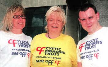 Karen Irvine and Peter Irvine who are taking part in a Sponsored Tandem Skydive for Cystic Fibrosis Trust also pictured is Linda Alexander (Centre) Regional Manager Cystic Fibrosis Trust- US2111-118A0