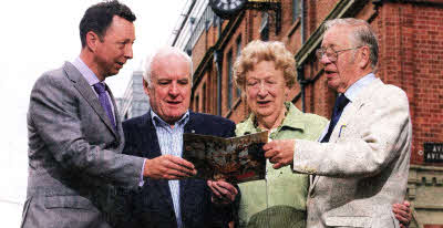 Paul Simpson, General Manager of Ormo, outside the old bakery on the Ormeau Road with retired Ormo employees George Noble, Betty McLaverty and Bob Armitage.