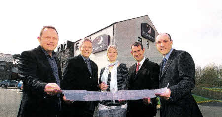 First Minister Peter Robinson and Minister of the Environment Edwin Poots join Andy Orr and Jill Moore of Premier Inn, and Des Taggart of Conway Group to review plans for a £2m extension of Premier Inn Lisburn.