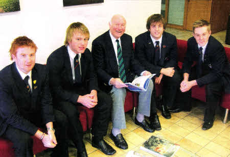 Current Wallace High School rugby players welcome Raymond Hunter, past pupil and British Lion to school recently