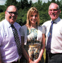 Fay Ballard, the first ever Rotary Peace Fellow from Lisburn, is congratulated on her success by the outgoing President of the Rotary Club of Lisburn, who sponsored her application, Trevor Stewart and outgoing secretary David Brown. Fay, who works for the GOAL charity in Sudan, is now studying with other Rotary peace fellows in Thailand. During the programme they will visit Cambodia and the Burmese border.
