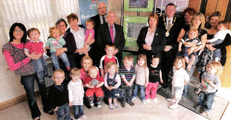 Members of Maghaberry Community Centre's Mother and Toddler group try out one of Lisburn City Council's Public Access Internet Kiosk Also pictured are Chair of the Local Action Group, Councillor Allan Ewart; Vice-Chair of Lisburn City Council's Economic Development Committee, Alderman Jim Dillon; Chairman of Lisburn City Council's Economic Development Committee, Councillor Jenny Palmer and Mayor, Alderman Paul Porter.