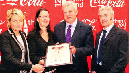 L-R: Maire Campbell, Coca-Cola Hellenlc Ireland, Claire Patience, RNIB, Minister Fergus 0'Dowd and James Laverty, NICVA. Lisburn in Focus was one of only three organisations from NI who were awarded a Coca Cola 125 Years Celebration fund grant.