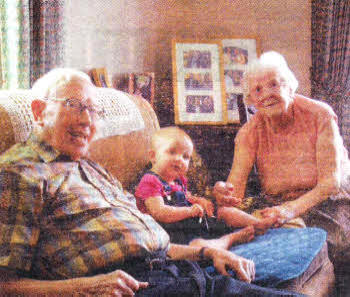 Tom Hinds with his wife Betty and great granddaughter