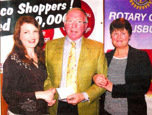 George Christie presents a cheque to Kathryn Dickson, chairperson, and Janet Stirling, secretary, of the Lisburn committee of Cancer Research UK.