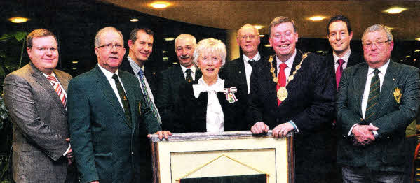 Lisburn branch UDR Association Chairman Michael Rooney and Co. Antrim Lord-Lieutenant Joan Christie present Lisburn Mayor Paul Porter with a gift in return for the council hosting a reception for the association. They are joined by members of the association and DUP MLA's USO411-404PM Pic by Paul Murphy