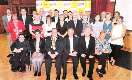At the 2011 Mayor's Awards for Volunteering held recently at Lagan Valley Island are the nominees for the Adult Volunteer Category with (front row 1.r) Ms Wendy Osbourne OBE; the Mayor of Lisburn, Alderman Paul Porter; Social Development Minister Mr Alex Attwood MLA and Mr John Day, compere at the Awards Gala Dinner.