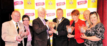With the Mayor of Lisburn, Alderman Paul Porters are the winners of each of the four categories at the 2011 Mayor's Awards for Volunteering held recently at Lagan Valley Island, Lisburn. Present are: (1-r) Mr. Cecil Walker, Lisburn Cricket Club who won Adult Volunteer of the Year; Ms. Wendy 0sbourne 0BE, Volunteer Now; Mr. Michael McCartney representing the Lisburn Citizens Advice Bureau which won Supporting Volunteer (Large Group); Ms Emma O'Neill, Glenavy Youth Project, who won Young Volunteer of the Year; Mr. John Daly, compere at Awards Gala dinner and Ms Evelyn Bronson representing Dunmurry Community Association which won Supporting Volunteer (Small Group).