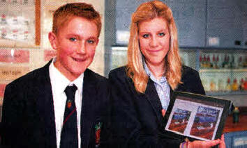 Brother and sister Timothee and Aimee Bassett with an iPad at Wallace High School.