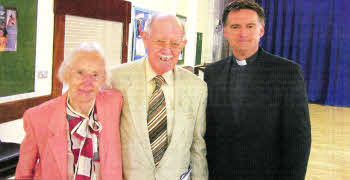 Kathleen and William Roe in Lisburn to celebrate their 64th wedding anniversary. with the Rev. John Brackenridge.