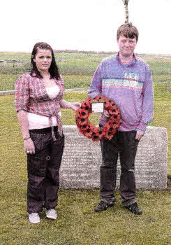Demi Stewart and Kealan McVeigh lay a wreath at the Ulster Tower on behalf of both schools.