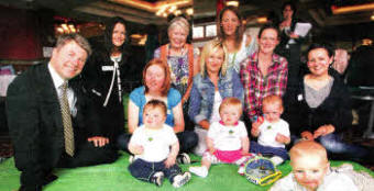 Mums and babies from the Lisburn area with Hugh McCaughey (Chief Executive, South Eastern HSC Trust) and Trudy Brown (Health Development Specialist, South Eastern HSC Trust - back row 2nd right) at the baby celebration event.