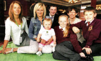 Trudy Brown (Health Development Specialist, South Eastern HSC Trust - pictured left) Donna O'Hara and baby Katie and children from St Luke's Primary School. Also in the picture is Jason White (Assistant Director Health and Wellbeing, South Eastern HSC Trust) and Dr Elizabeth Mitchell (Deputy Chief Medical Officer, DHSSPSNI)