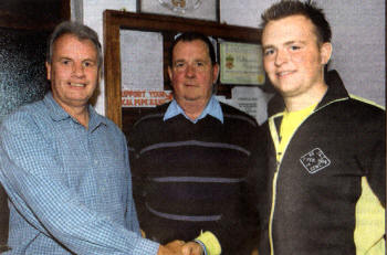 Leigh Anderson, right, the newly appointed Pipe Major at Banbridge Pipe band is congratulated on his appointment by Alan Gourley