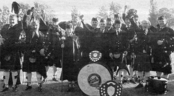 Drumlough Pipe Band celebrate their success in the Scottish Championships