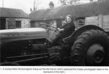 1. A young Maria McGurnaghan trying out the first tractor which replaced the horses, photograph taken in the