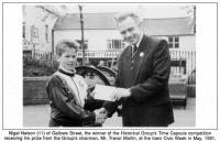 Nigel Nelson (11) of Gallows Street, the winner of the Historical Group's Time Capsule competition receiving his prize from the Group's chairman, Mr. Trevor Martin, at the town Civic Week in May, 1991.