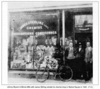 Johnny Bryson & Minnie Mills with James Stirling outside his chemist shop in Market Square in 1932. (F.G.)