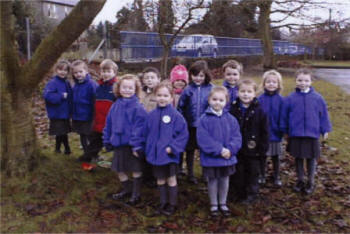 The children work outside to enhance the grounds of the school for the Best Kept Small School Award. They received a Highly Commended. 2003