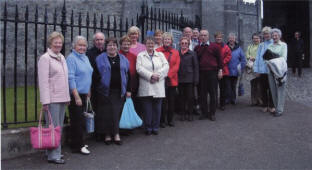 Some members of the group pictured at the gates of Kilkenny Castle, which dates from the 13th century, prior to a guided walking tour of Kilkenny.
