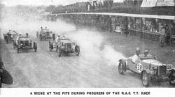 A SCENE AT THE PITS DURING PROGRESS OF THE R.A.C. T.T. RACE