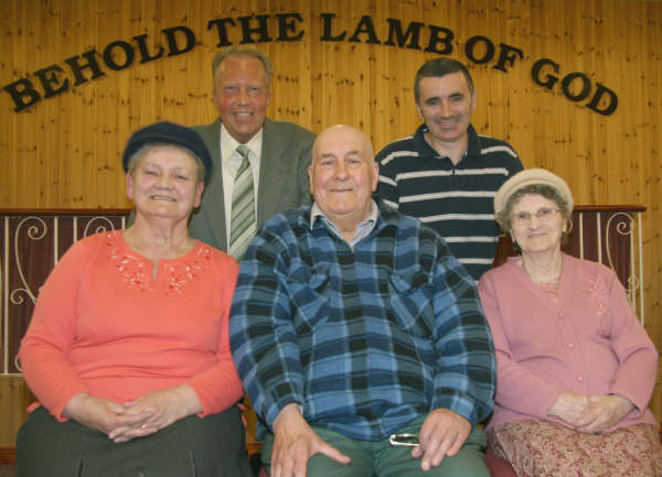 Committee members L to R: (seated) Jean Smyth, William Waite, and Sally McKinstry pictured with (standing) John Thompson and Tommy Selby at a prayer meeting in Ballydonaghy Mission Hall in April 2009. 