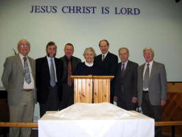 The Church Board. L to R Rennie Braithwaite, James Elwood, Sidney Sloan, Rev. Irene Wallace, Paul Wallace, Jim Spratt and Donald Kelly. Missing from the photo: Sadie Mulholland, Maureen King and Eileen Oliver.