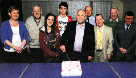 Cutting the 20th Anniversary cake: (from left to right) Debbie Davidson (leader of Lisburn Causeway Group), Gordon Cunningham, Jessica Donaldson, Matthew Thompson, Pete Winmill (Prospects Assistant Director of Mission and Ministry), Mervyn Bothwell (Prospects Regional Director), Stephen McCracken, David Twyble and Irvine McCabe