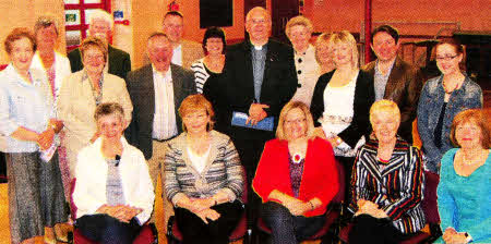 Rev Brian Anderson, Damask Secretary Jane Dawson and a group of the Damask volunteers who attended the coffee morning