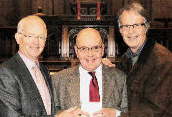 Rev Douglas Mark, who is retiring as Pastoral Assistant of Railway Street Presbyterian Church, receiving a farewell gift from the Rev Brian Gibson (left) and Roger Thompson, Clerk of Session (right).