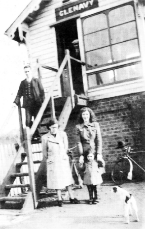 Pat outside the cabin with The Kenny family during the war years.