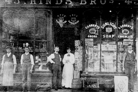 A photograph taken in the early 1900's outside Hind's Brothers, 45 Bow Street, Lisburn. Samuel James Downey is believed to be on the first left.