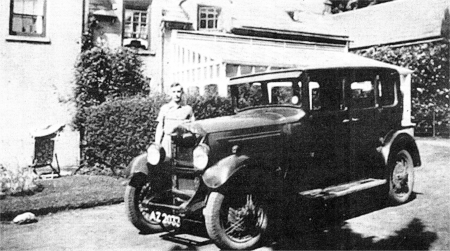 Hal Downer at his stepmother's house at Chrome Hill, Lambeg. The 'AZ' lettering in the vehicle registration number was issued to vehicles in Belfast City from 1928. 
						US3707-DOWNER1
