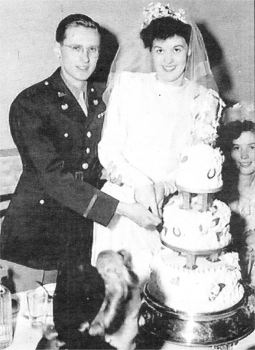 Newly weds Myrtle and Richard Neff cut their wedding cake