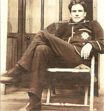The Rev David Corkey relaxes at an unknown location. He is dressed in his Boys Brigade uniform. He first worked for the BB in 1908 during his time at the Shankill Road.