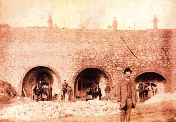 An early 20th century photograph of the lime kilns at Moneybroom. William Belshaw is believed to be the man standing in the foreground of the picture. In 1953 he was elected Vice-President of the Northern Lime Producers' Association.