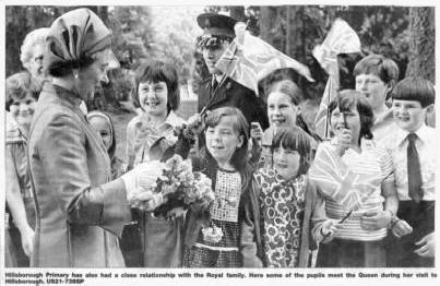 Hillsborough Primary has also had a close relationship with the Royal family. Here some of the pupils meet the Queen during her visit to Hillsborough. US21-738SP