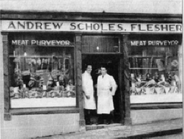 Tom Scholes, left, and Sammy Hanna at the door of Schole's Butcher's Shop, in the 1950s.