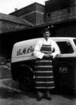 A fresh-faced 18-year-old Robert Cumins pictured in 1939 standing beside one of the delivery vans at J M Cumins butcher s shop in Bow Street.