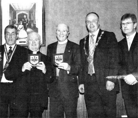 Lisburn City Council Mayor,Councillor James Tinsley presents Rev Canon Alex Cheevers and Father Gerard McGreevy with a token of appreciation for their role in Sunday's Rededication of the War Memorial. Looking on are Chairperson of the Royal British Legion, Mr Maurice Leathem and Lagan Valley MP Jeffrey Donaldson.