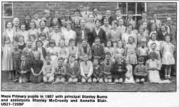 Maze Primary pupils in 1957 with principal Stanley Burns and assistants Stanley McCready and Annette Blair.