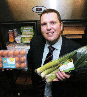 Councillor Andrew Ewing, Chairman of the Council's Environmental Services Committee showing residents that it is possible to freeze all sorts of foodstuffs including eggs and vegetables.