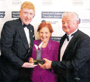 Receiving the award from Duncan McCausland, NITB Board Member are Pauline and Sam Johnston, Brookhall Historical Farm