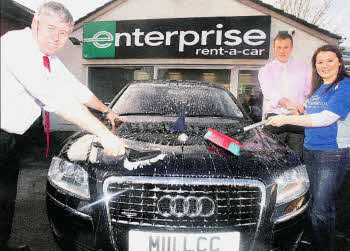 Pictured rolling up their sleeves for a charity car wash with Enterprise Rent-A-Car, based at Young Street Lisburn, which will take place on Saturday 4th February, is the Mayor, ClIr Brian Heading; Ms Rosie Hassin from the Ulster Cancer Foundation and Mr Michael Irwin, Enterprise Rent-A-Car.