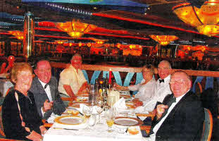 At dinner on the Costa Concordia. Lisburn man Billy Magee, centre left, Sam Hewitt, centre right.