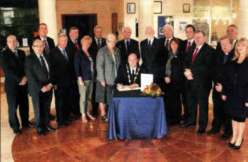 Mayor of Lisburn City Council, Alderman William Leathern signs the Book of Condolence, opened for The Spence Family. Looking on are Elected Representatives and Senior Council Officers. Books of Condolence have been opened at Lagan Valley Island, the Lagan Valley LeisurePlex and the Irish Linen Centre and Lisburn Museum in the City.