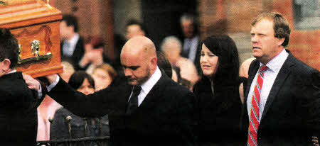 Family and friends carry the coffin of David Preece aged 15 during his funeral at St Patrick's Church in Donacloney