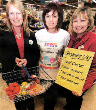 Debbie Cocking helping to launch the Tesco Charity of the Year with Ann Broome and Sue Kelly of Tesco. US1112-137A0
